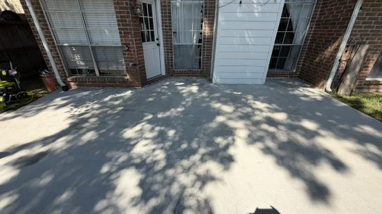 Patio surface after cleaning, with tree shadows across it